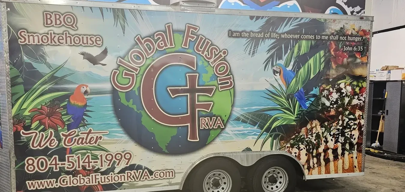 Global Fusion RVA's branded food trailer, showing the tropical wrap, Global Fusion logo, and BBQ Smokehouse signage