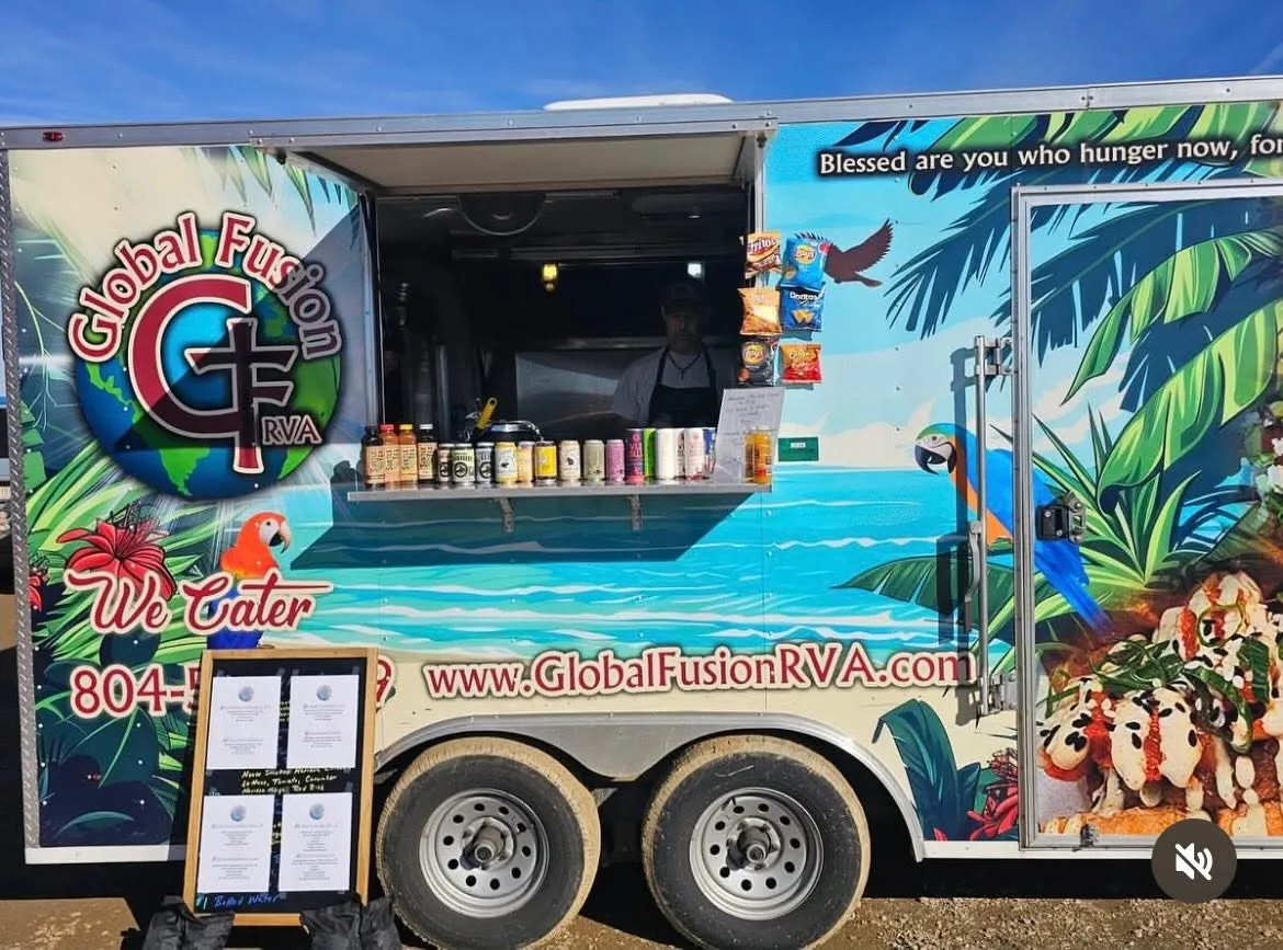 Global Fusion RVA's branded food truck, with the tropical-wrapped serving window open for business