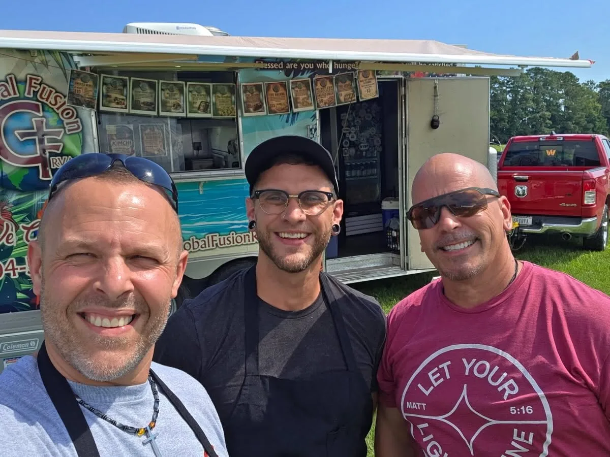 Global Fusion RVA's team together in front of the branded food truck
